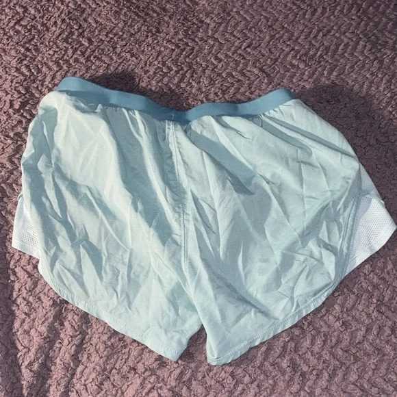 2 pairs of Under Armor running shorts. Size small. - Picture 4 of 5